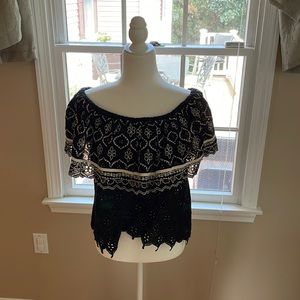 Crochet black top with floral detailing. Made in India.